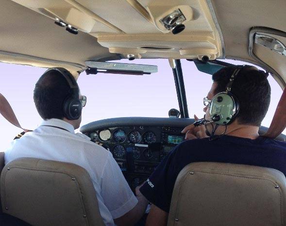 Flight instructor with student